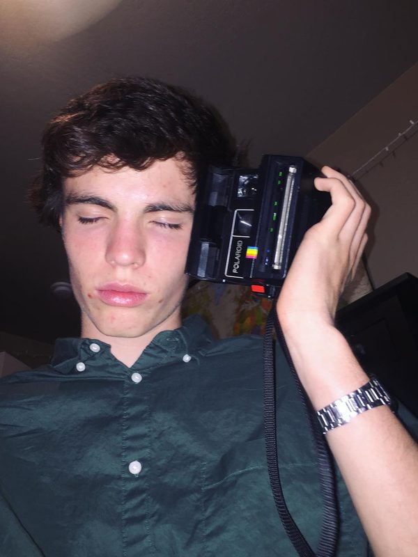 I bet your man doesn't use his Polaroid camera as a phone